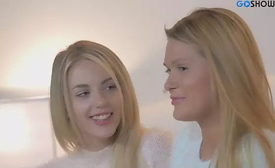 Erotic Blonde Seductress Unveils Stripping Delights On Bed